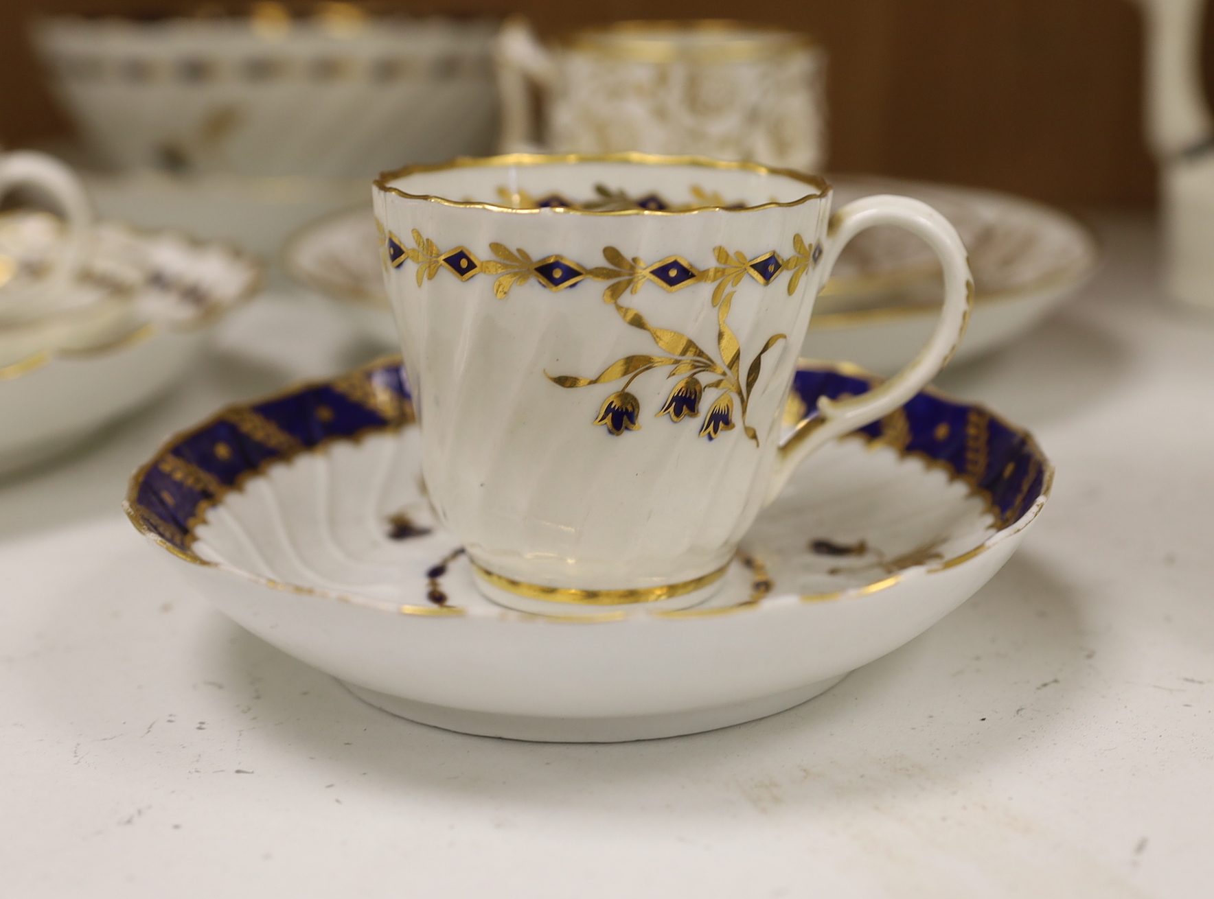 Two Flight Barr and Barr coffee can and matching saucer dish with gilded strawberries, four Flight cups and saucers, two Flight saucer dishes and a bowl together with a Chamberlain coffee can and saucer, bowl 15cm diamet